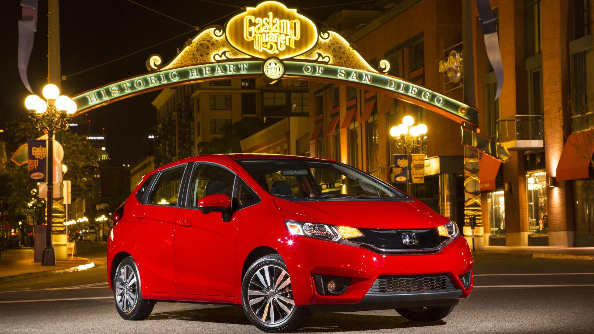 front view of Honda Fit on a street at night