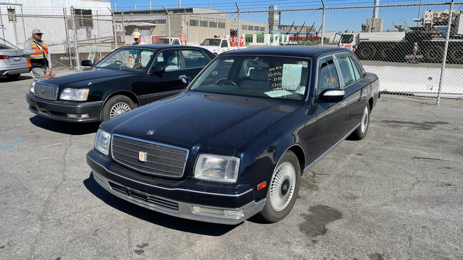 Front of Toyota Century's, in auction lot.