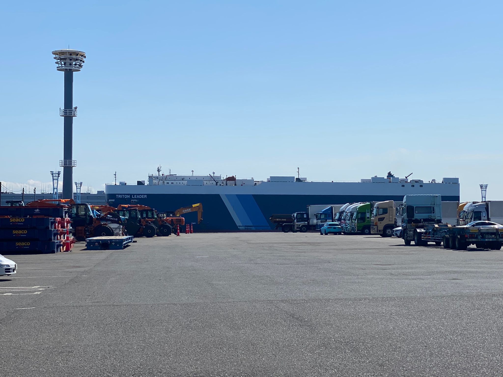 Photo of a Zervtek JDM car besides a RORO cargo vessel
