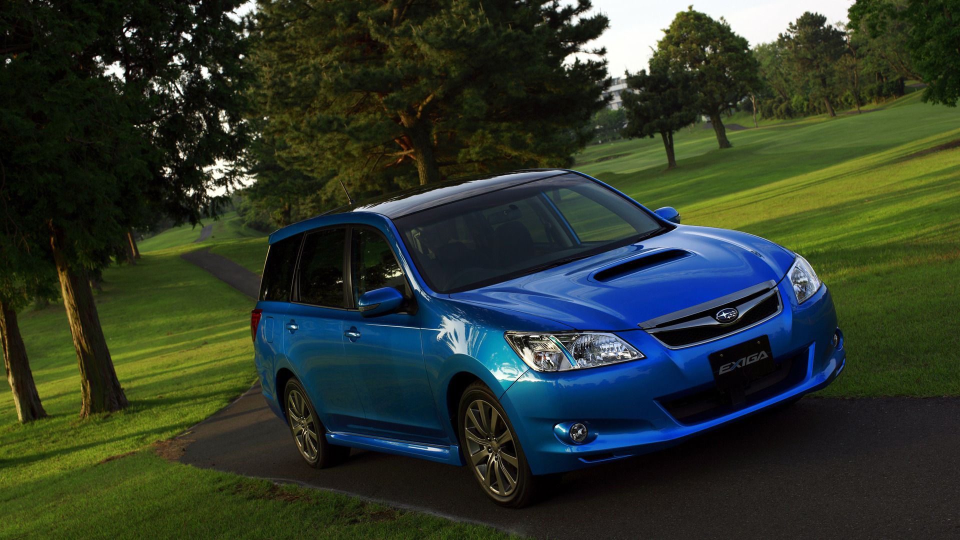 Front view of Subaru Exiga in a forest region